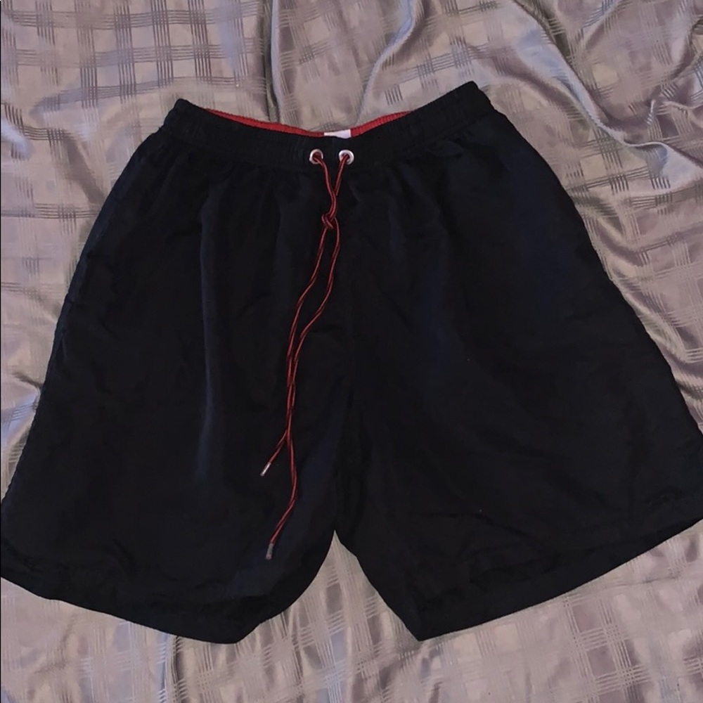 Black swim shorts/ board shorts